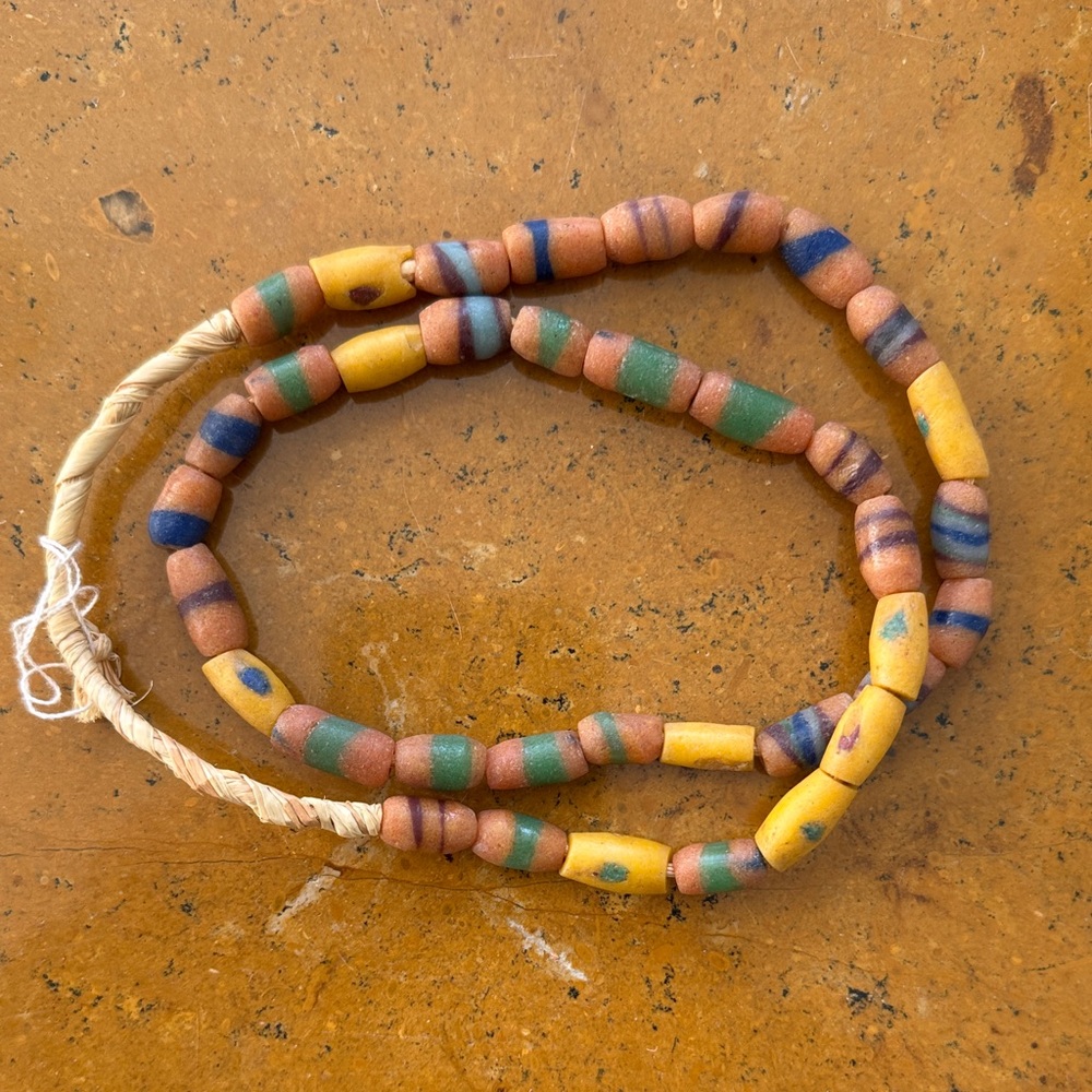 African beads necklace-  22 inches of beads not including the exposed twine.